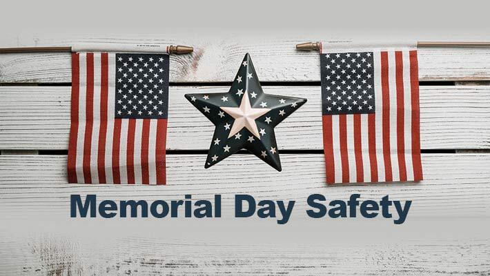 Memorial Day Safety. A star with two small American flags.